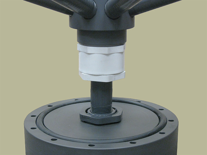 Close-up view of SWT's PVC reducer bushing in DS assembly